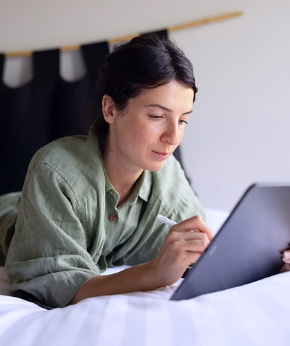 A person completing a referral on a tablet at home